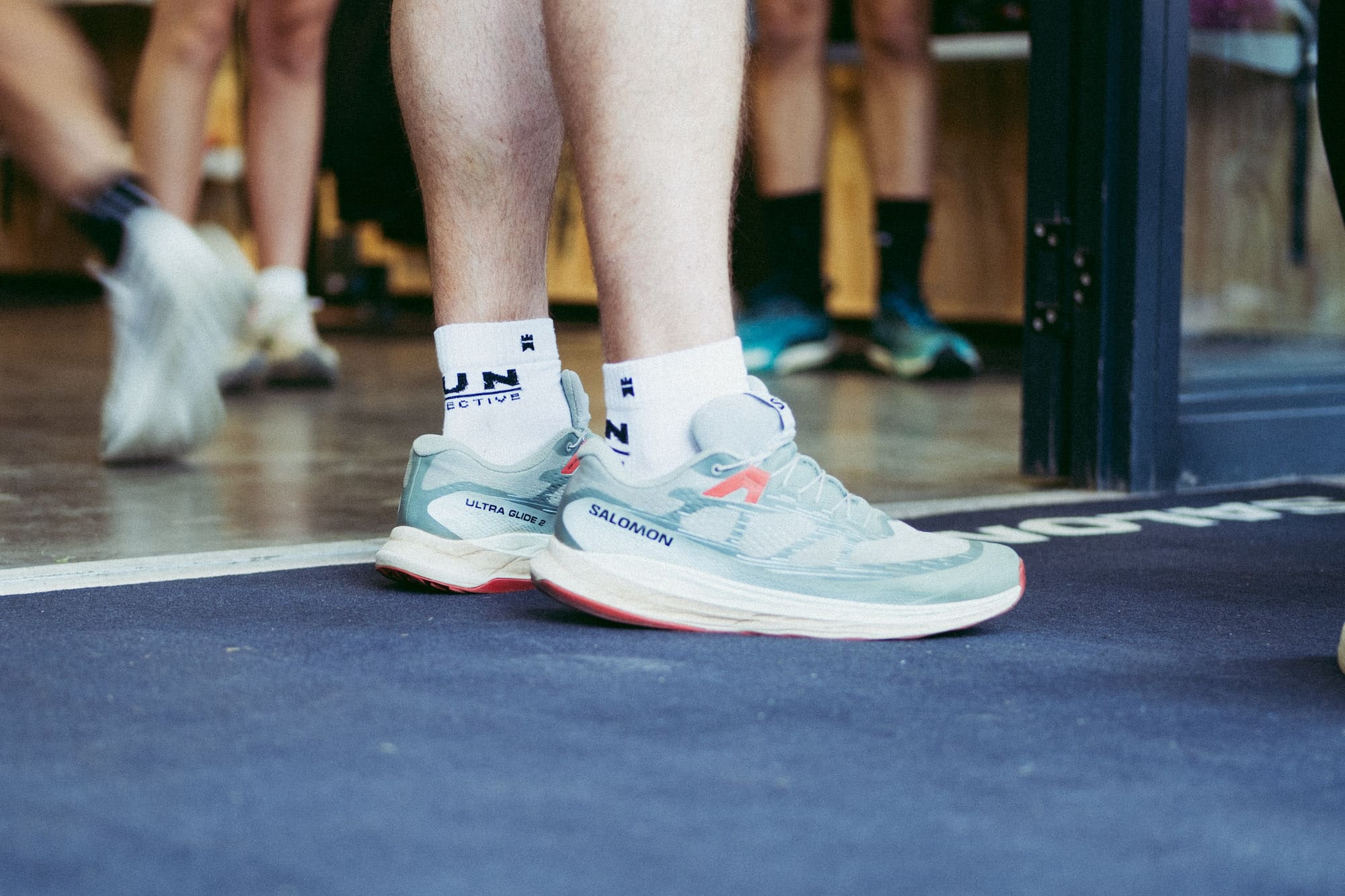 A photograph of the run collective custom sock in a pair of Salomon running shoes.